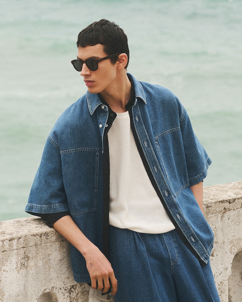 Kaplan Hani sports an oversized COS short-sleeve denim shirt with a knit tank.