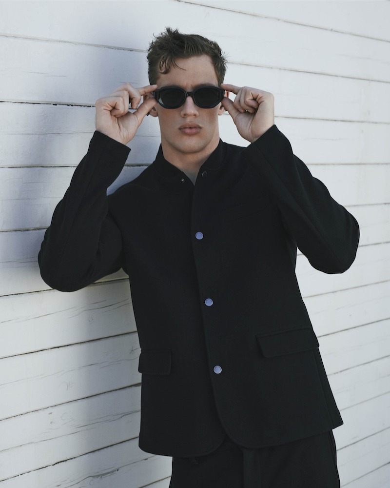 Model Benjamin Arvay dons black tailoring by Emporio Armani.