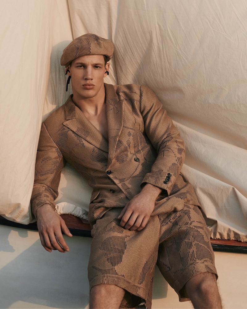 Benjamin Arvay models a printed double-breasted short suit with a matching beret by Emporio Armani.