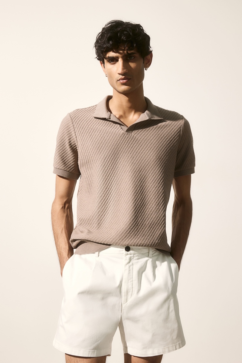 Neeraj Saini wears an H&M waffled polo shirt with pleat-detailed shorts.