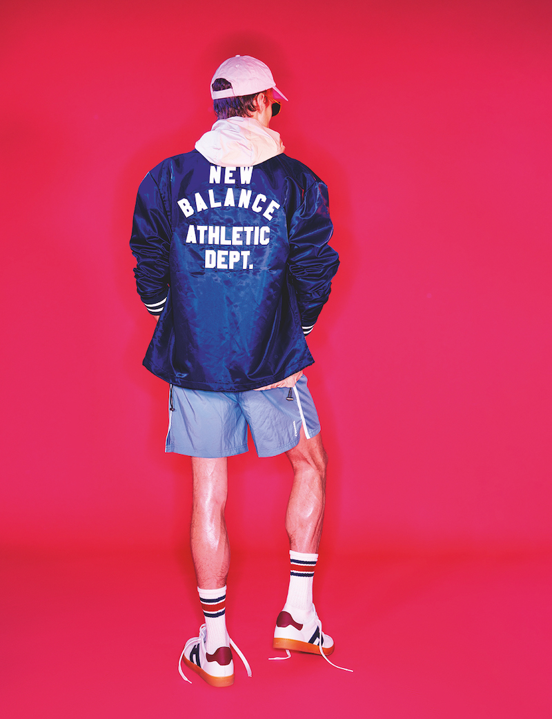 Hugh wears nylon jacket New Balance, hooded jacket GUESS, shorts PUMA, and sneakers Hogan.