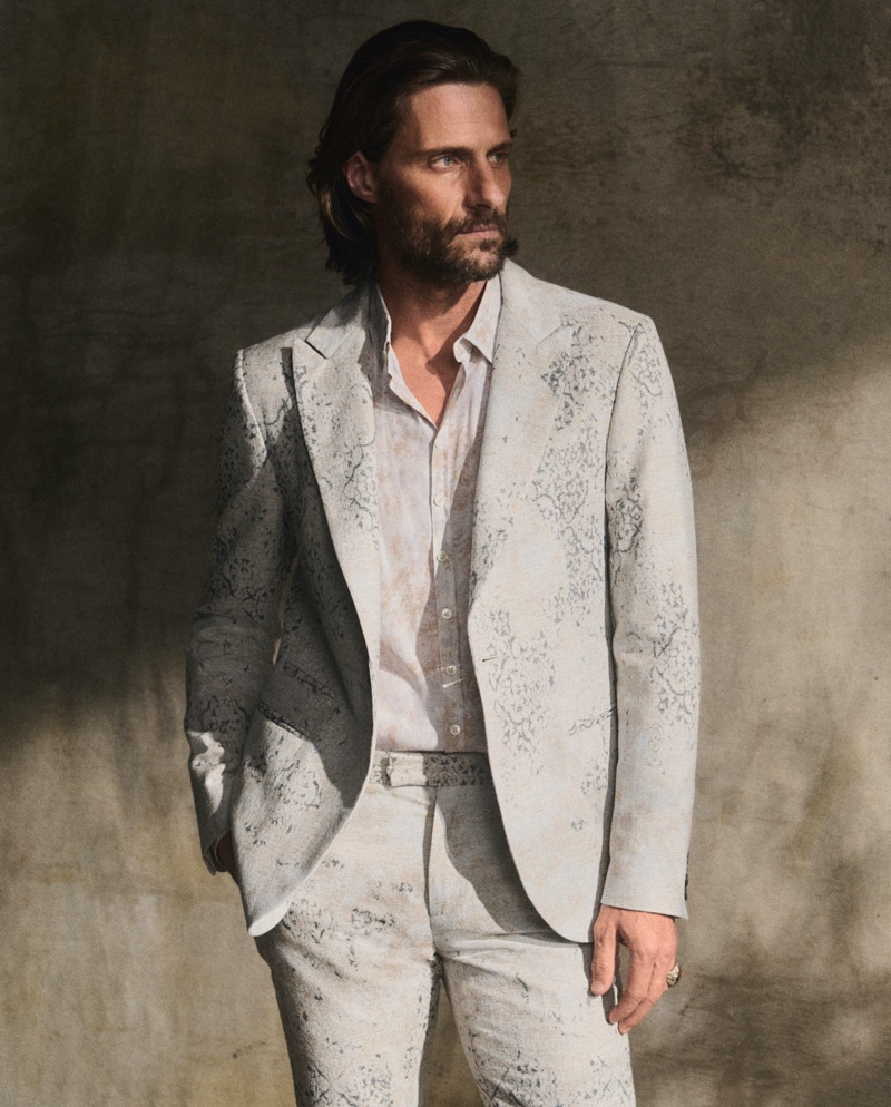 Tommy Dunn wears a jacquard suit from John Varvatos' pre-fall 2024 collection.