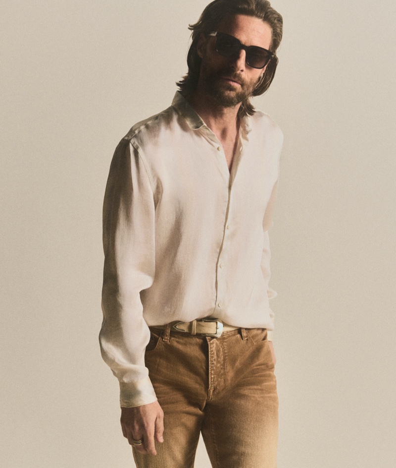 Wearing John Varvatos' pre-fall 2024 collection, Tommy Dunn sports a neutral-colored look.