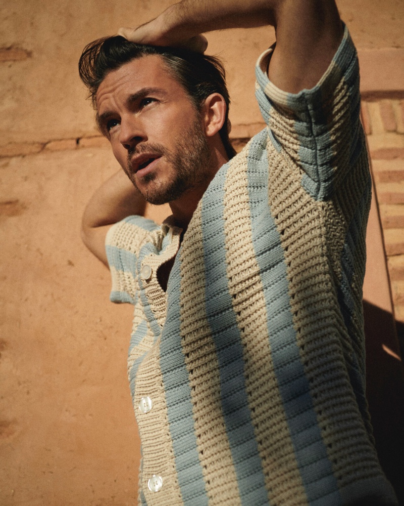 Jonathan Bailey stars in Orlebar Brown's summer 2024 campaign and wears a stripe crochet knit shirt.