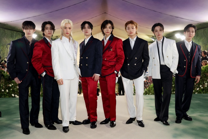 Stray Kids makes a splash in red, blue, and white Tommy Hilfiger suits at the 2024 Met Gala. 