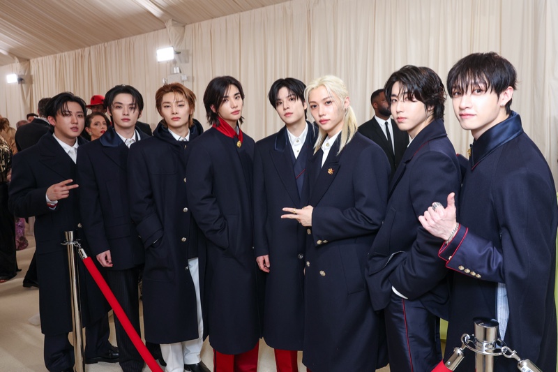 Clad in custom overcoat, Stray Kids arrives at the 2024 Met Gala in Tommy Hilfiger.
