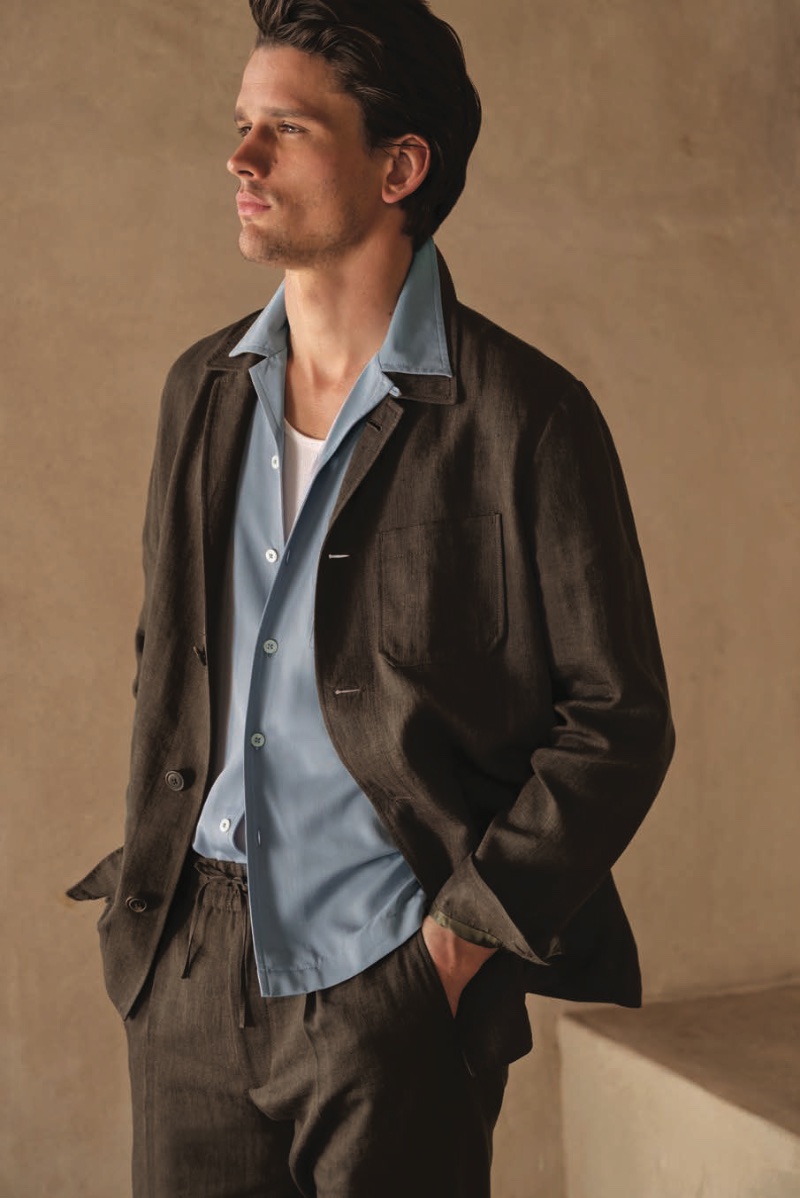 Donning Italian linen, Simon Nessman sports a chore jacket and drawstring trousers with a short-sleeve Hollywood shirt.