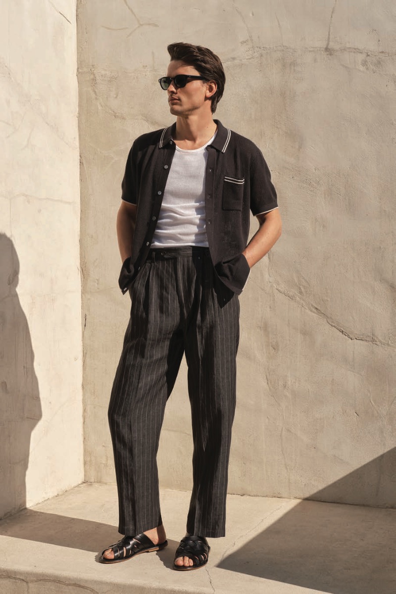 Model Simon Nessman wears a Todd Snyder full-placket polo with pinstripe Italian linen trousers and leather sandals.