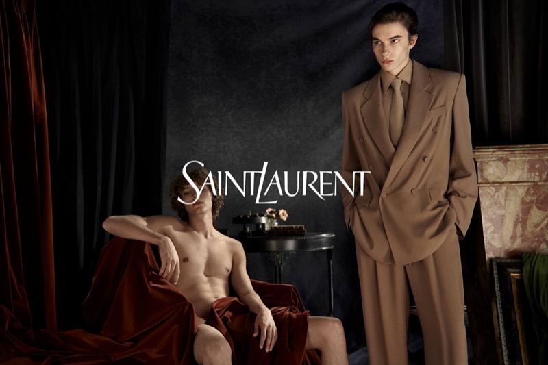 Thomas LeMaigre dons a brown double-breasted suit, appearing alongside a barely clad Vassili Schneider in Saint Laurent’s winter 2024 campaign. » Saint Laurent Winter 2024 Flirts with Cheeky Campaign Thomas LeMaigre dons a brown double-breasted suit, appearing alongside a barely clad Vassili Schneider in Saint Laurent’s winter 2024 campaign.