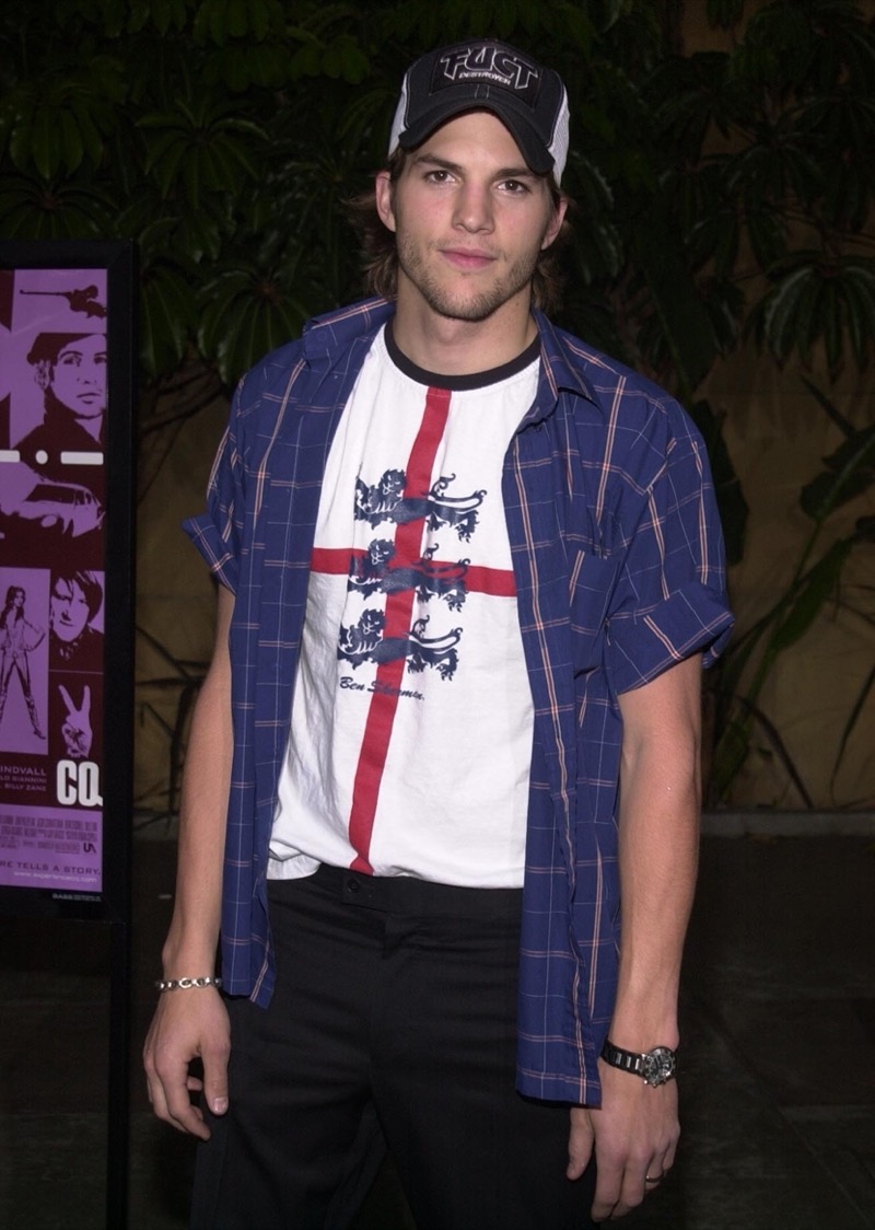 Ashton Kutcher 2000s fashion men trucker hat plaid shirt graphic ringer tee