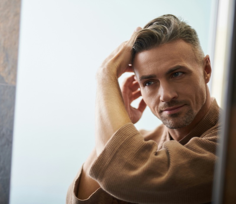 man styling hair