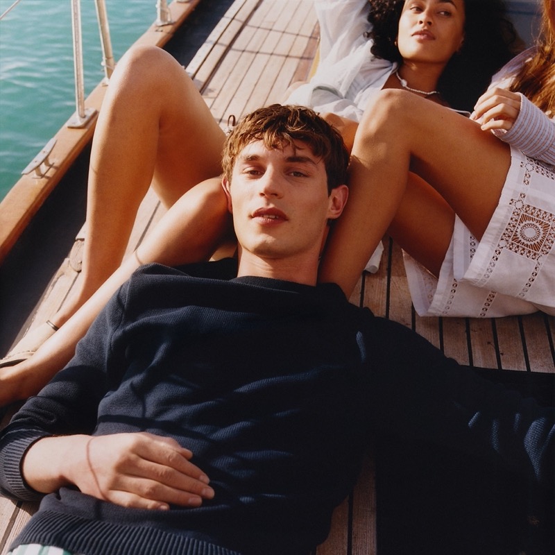 Kit Butler relaxes in J.Crew's Heritage cotton boatneck sweater in navy. » J.Crew Finds Style in the Sun for Summer 2025 Kit Butler relaxes in J.Crew's Heritage cotton boatneck sweater in navy.