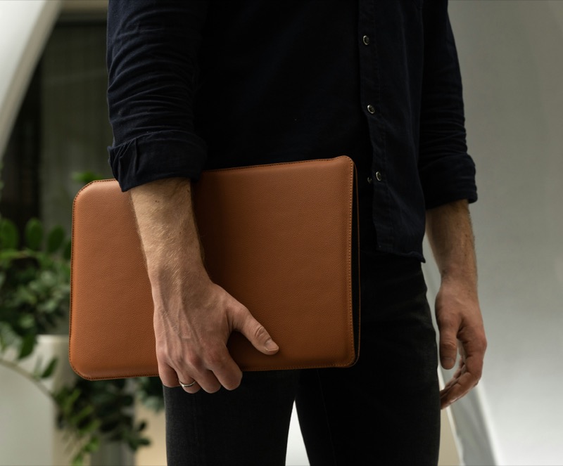 A leather laptop sleeve adds intention to mobility, turning protection into part of the presentation. » 12 Leather Goods for Men That Add Style to the Everyday A leather laptop sleeve adds intention to mobility, turning protection into part of the presentation.