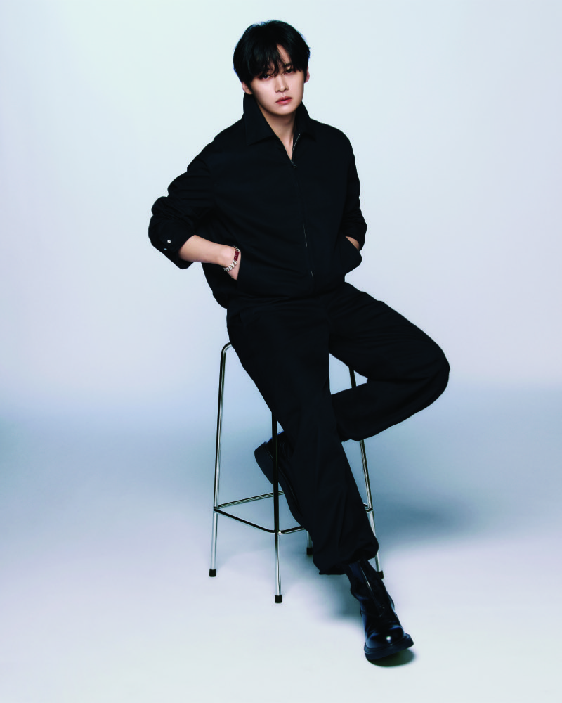 Lee Know cuts a sharp figure in black, as Gucci's newest global brand ambassador.