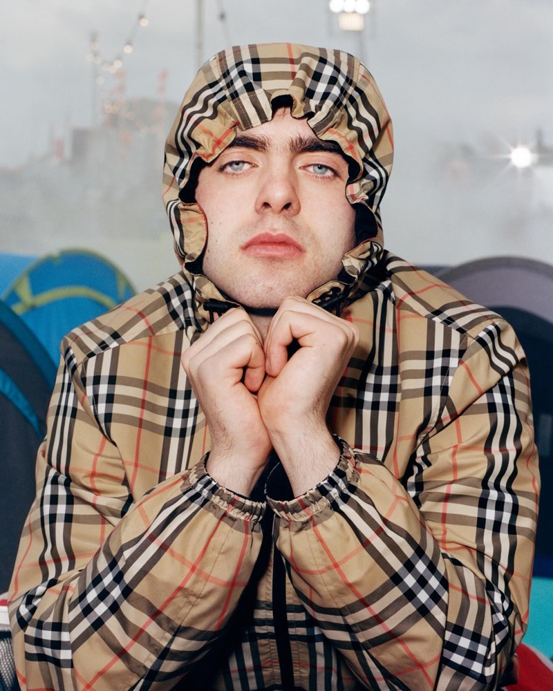 Lennon Gallagher sports a check hooded jacket for the Burberry Festival campaign. » Burberry Festival Puts the Gallaghers in the Spotlight Lennon Gallagher sports a check hooded jacket for the Burberry Festival campaign.