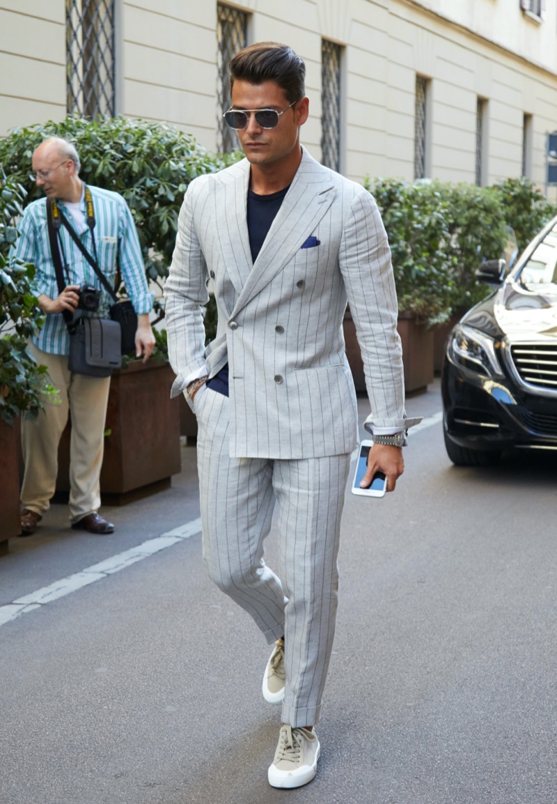 A soft-shouldered, pinstripe Italian suit worn with sneakers is at its most casual and camera-ready. » How American, British & Italian Suits Make Their Mark A soft-shouldered, pinstripe Italian suit worn with sneakers is at its most casual and camera-ready.