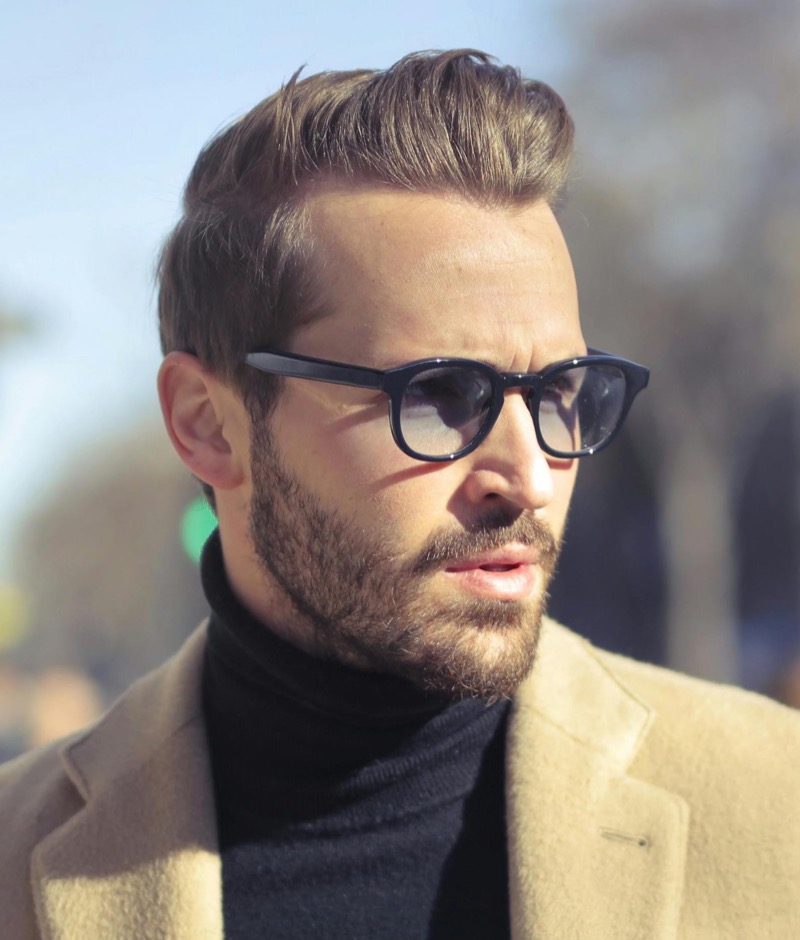man wearing minimalist black framed sunglasses