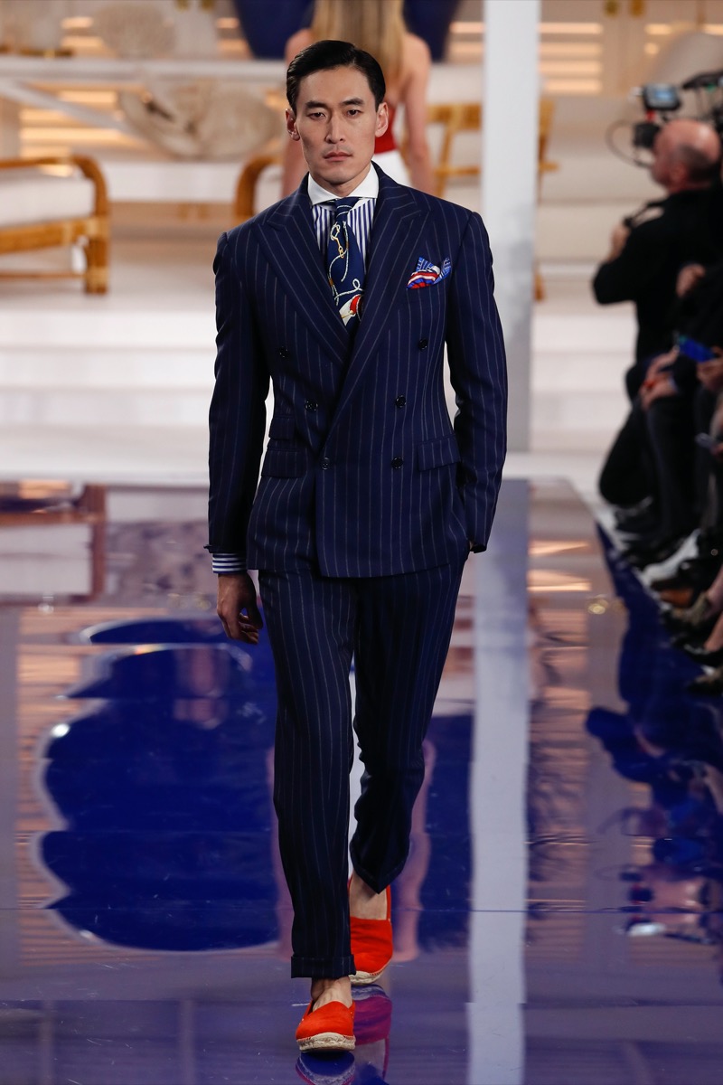 A pinstripe double-breasted suit, bold accessories, and unexpected footwear come together in a look that blurs the lines between British formality, Italian flair, and American showmanship. » How American, British & Italian Suits Make Their Mark A pinstripe double-breasted suit, bold accessories, and unexpected footwear come together in a look that blurs the lines between British formality, Italian flair, and American showmanship.