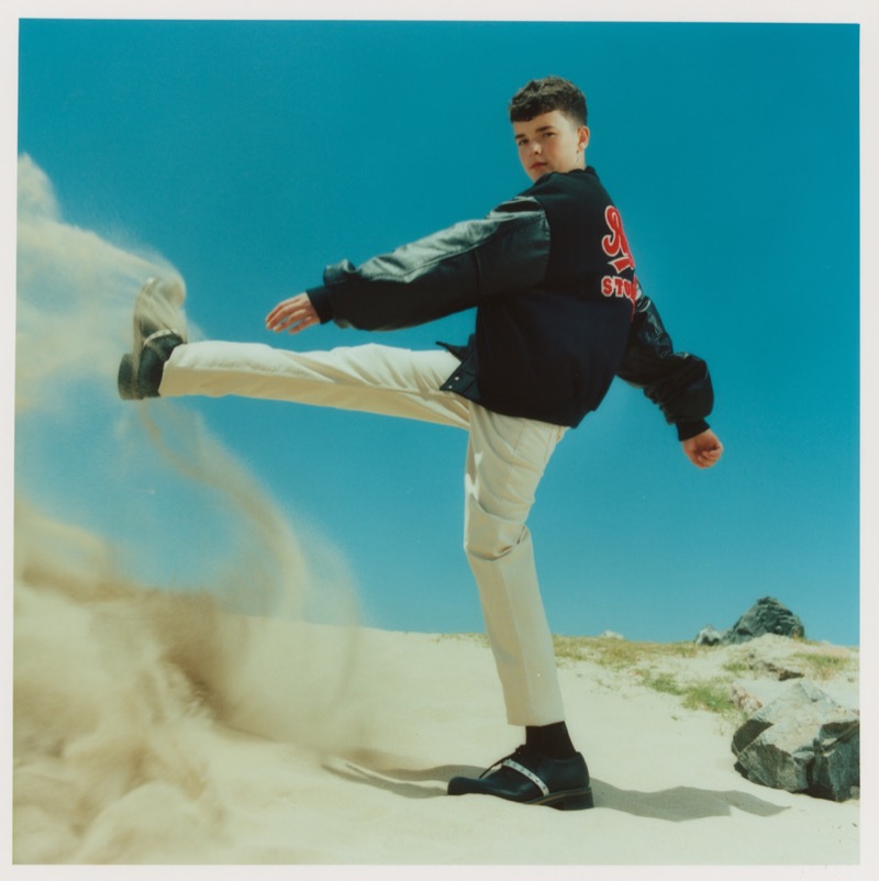 Owen Cooper wears a vintage Rolling Stones jacket with Versace pants and McQueen shoes for Flaunt.