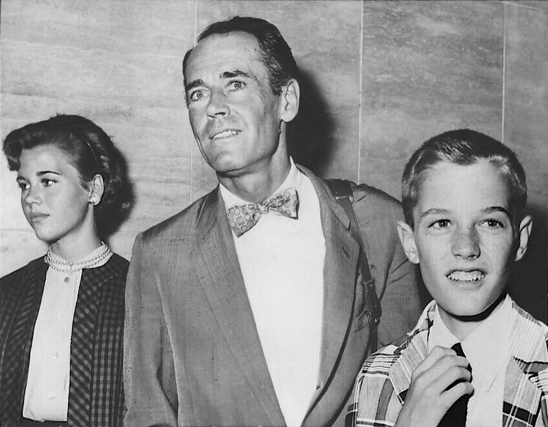 Henry Fonda wears a patterned bow tie, pictured alongside his children Jane and Peter.