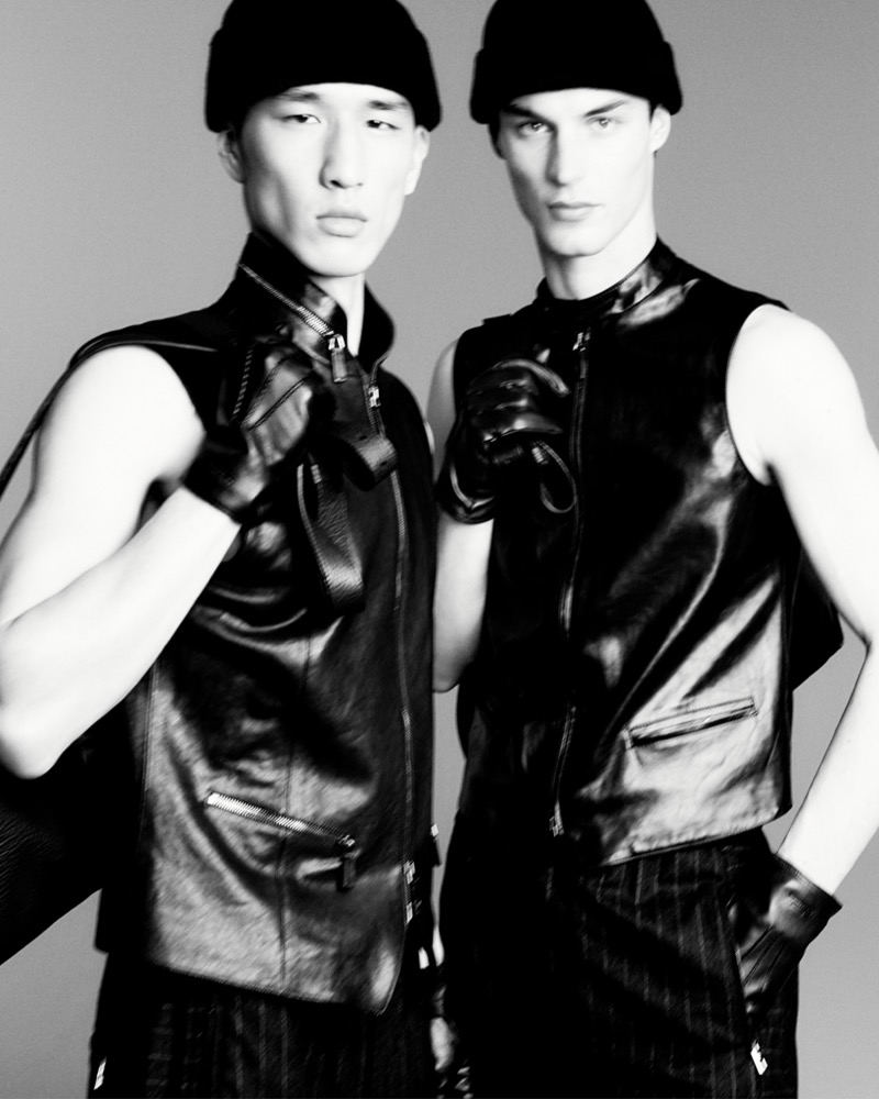 Models Long Li and Kit Butler sport leather vests from Giorgio Armani's fall-winter 2025 collection.