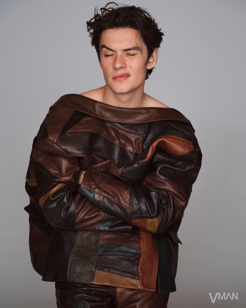 Louis Partridge wears a leather outfit by Prada for VMAN.