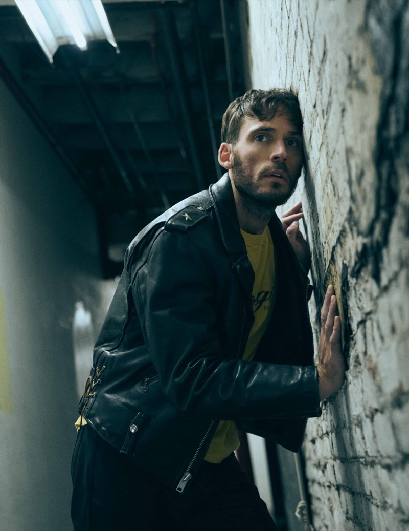 Sam Claflin wears vintage leather jacket and T-shirt with Perry Ellis pants Flaunt