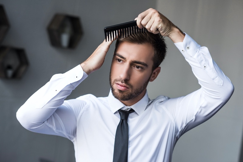 Man brushing hair