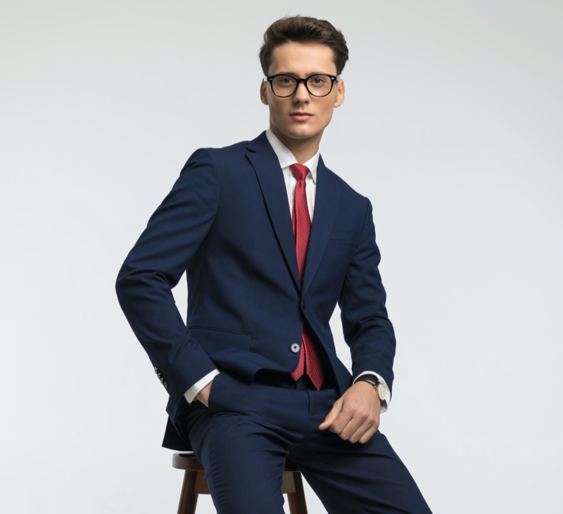 Man navy suit red tie