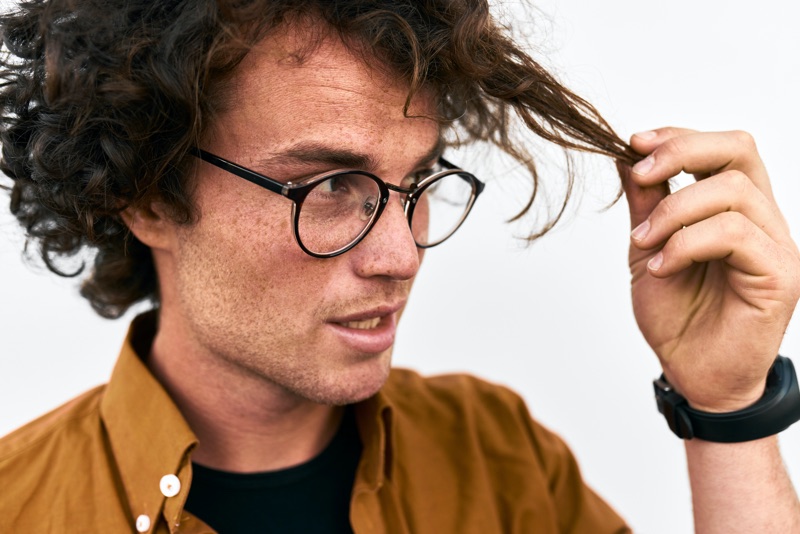 Man Touching Curly Hair