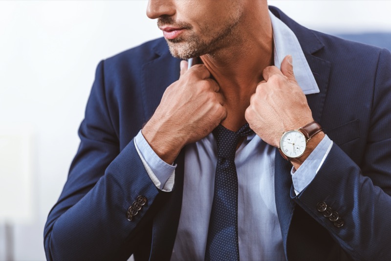 Navy suit brown leather watch