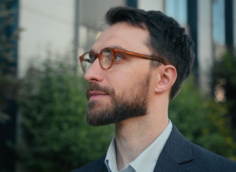 Professional Man Wearing Amber Color Eyeglass Frames