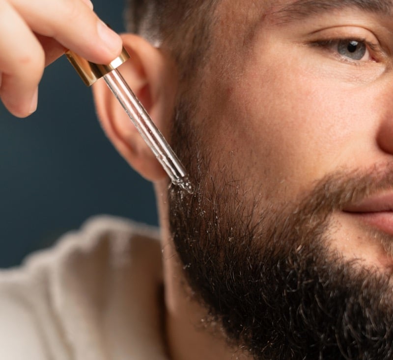 Man Using Beard Oil