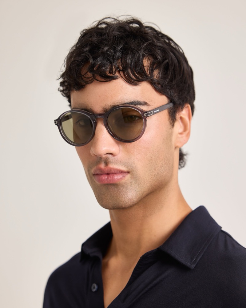 Model wears round acetate sunglasses