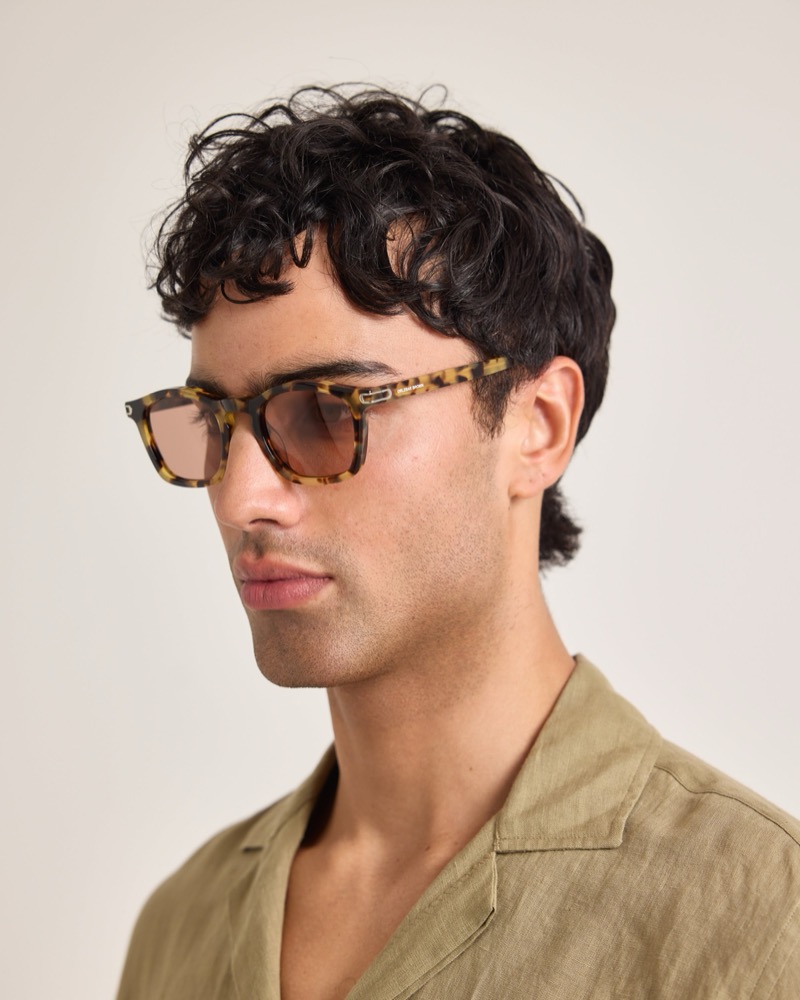 Model wears tortoiseshell sunglasses