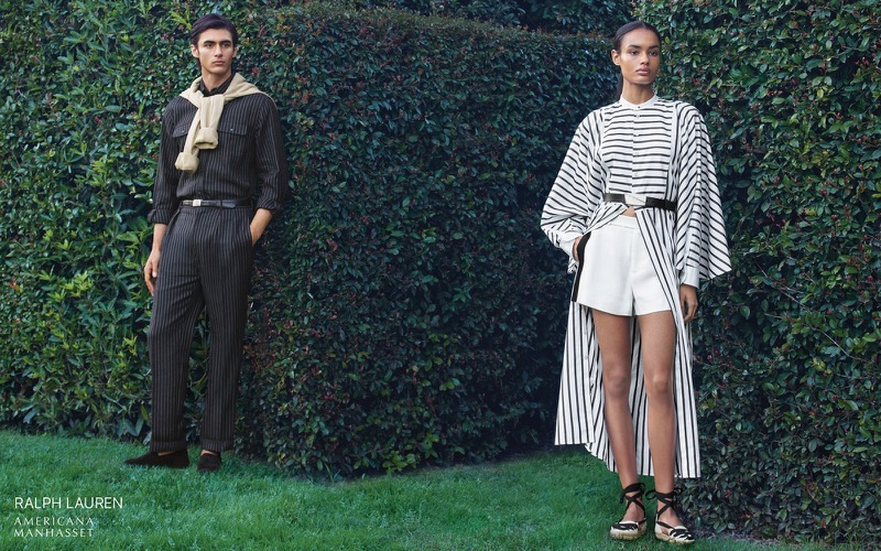 Akbar wears a Ralph Lauren pinstripe shirt with belted trousers and a sweater over the shoulders alongside Ana in a striped top with white shorts