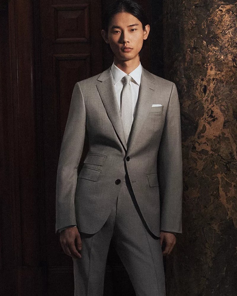 Taemin wears a pale gray BOSS Made to Order single-breasted suit