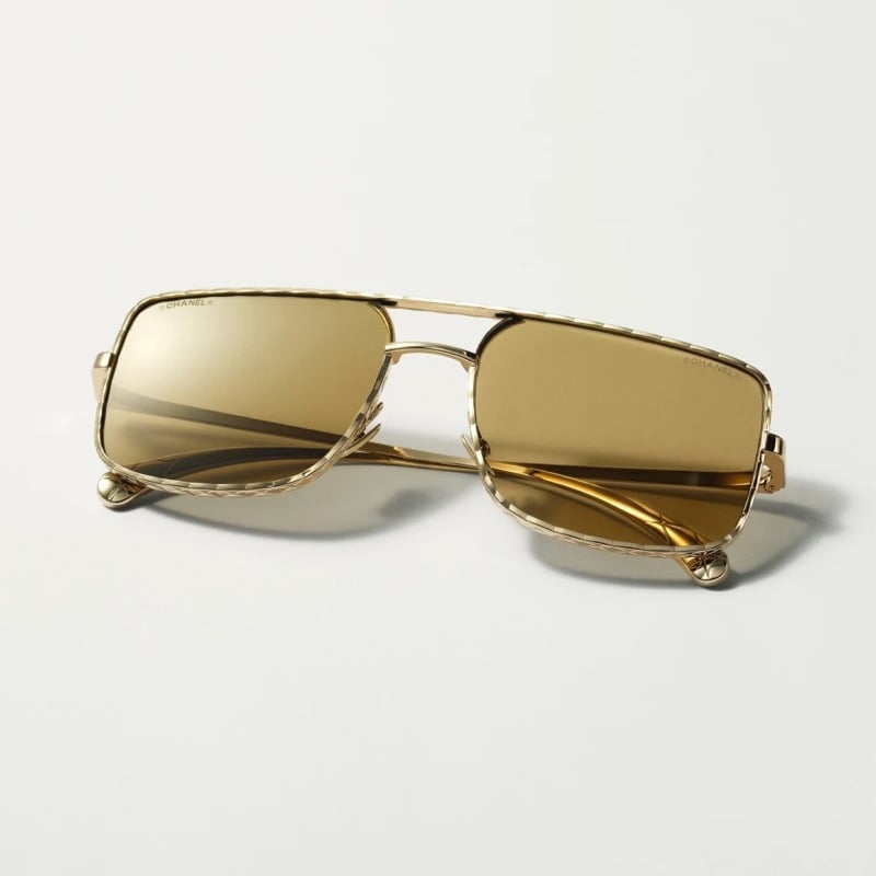 Chanel light gold pilot sunglasses with a double bridge and metal frame