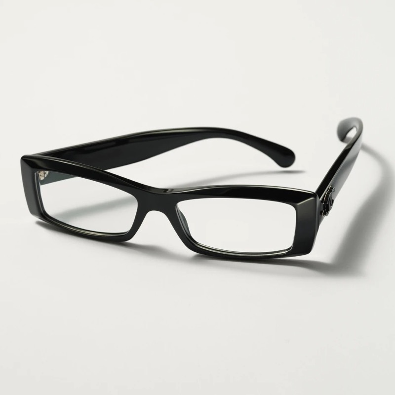 Chanel slim black rectangle eyeglasses in glossy acetate with a small silver double C emblem on the arm