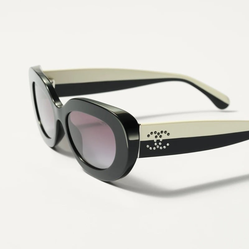 Chanel two-tone black and cream rectangle sunglasses with rose-tinted lenses and a crystal-set double C emblem on the arm