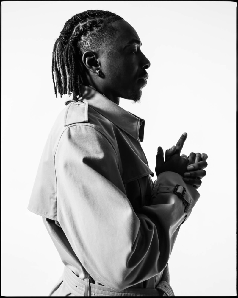 Eze wears a Burberry Kensington trench in a profile portrait