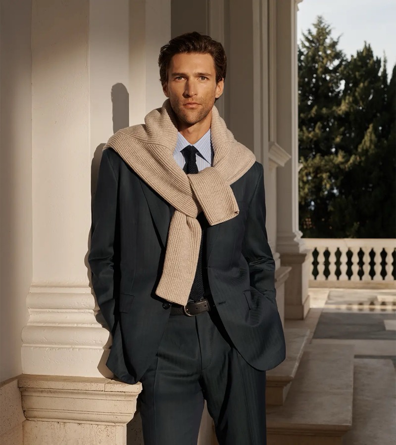 Fabrizio wears a Brioni suit with a sweater tied over his shoulders for spring-summer 2026