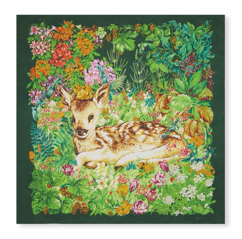 Gucci Art of Silk scarf with a fawn resting among dense green foliage and colorful flowers on a dark green ground