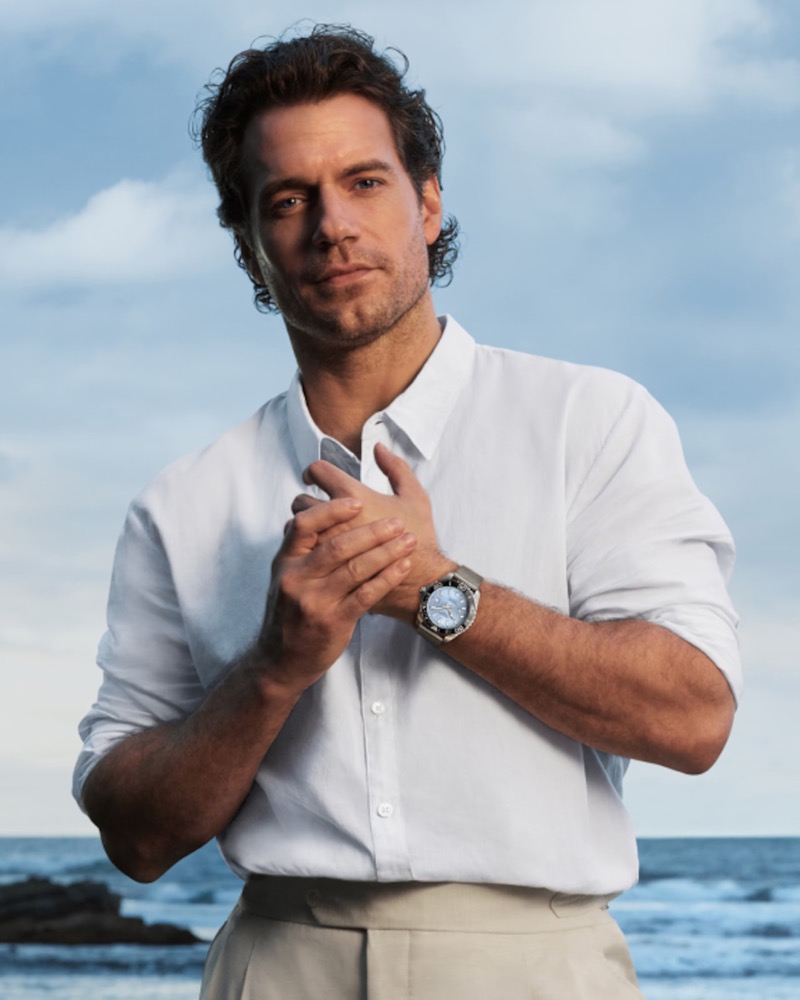 Cavill wears a white shirt with the Longines HydroConquest on a Milanese mesh bracelet