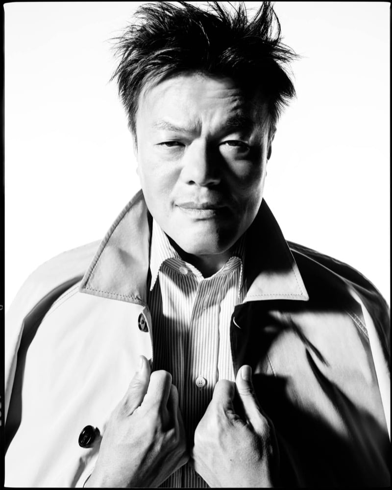 Park wears a Burberry Camden car coat over a striped shirt