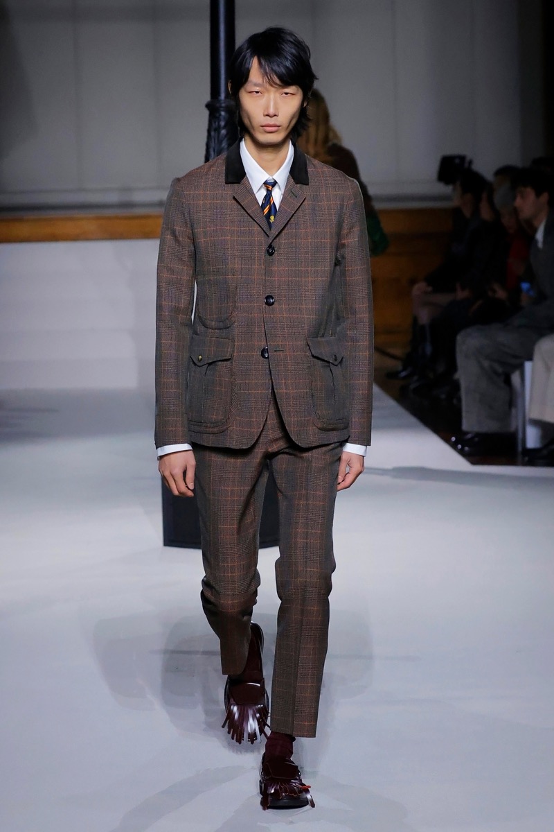 Kent & Curwen fall-winter 2026 brown windowpane check suit with patch pockets over a white shirt with a striped tie