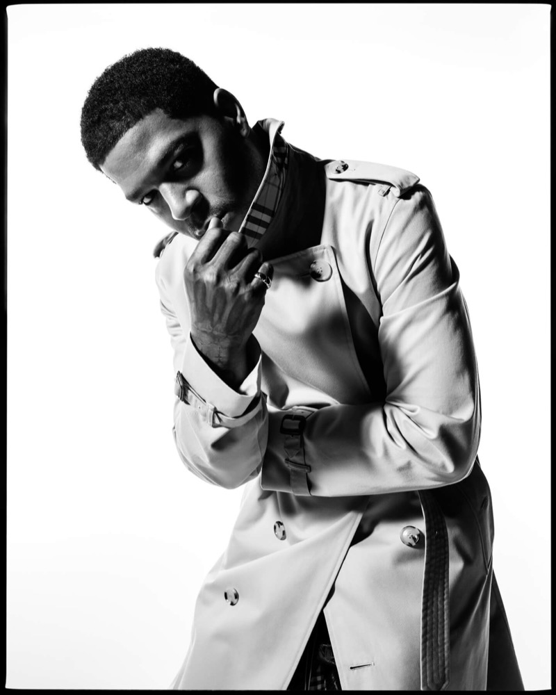 Kid Cudi wears a Burberry Kensington trench with the check lining visible