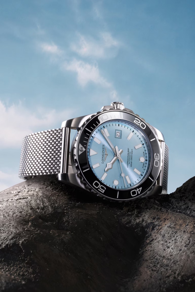 The Longines HydroConquest with a frosted blue dial and black ceramic bezel on Milanese mesh