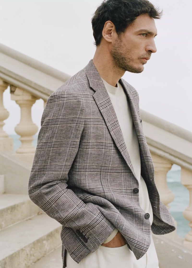 Pierre-Benoit wears a Prince of Wales check linen blazer over a cream crew neck