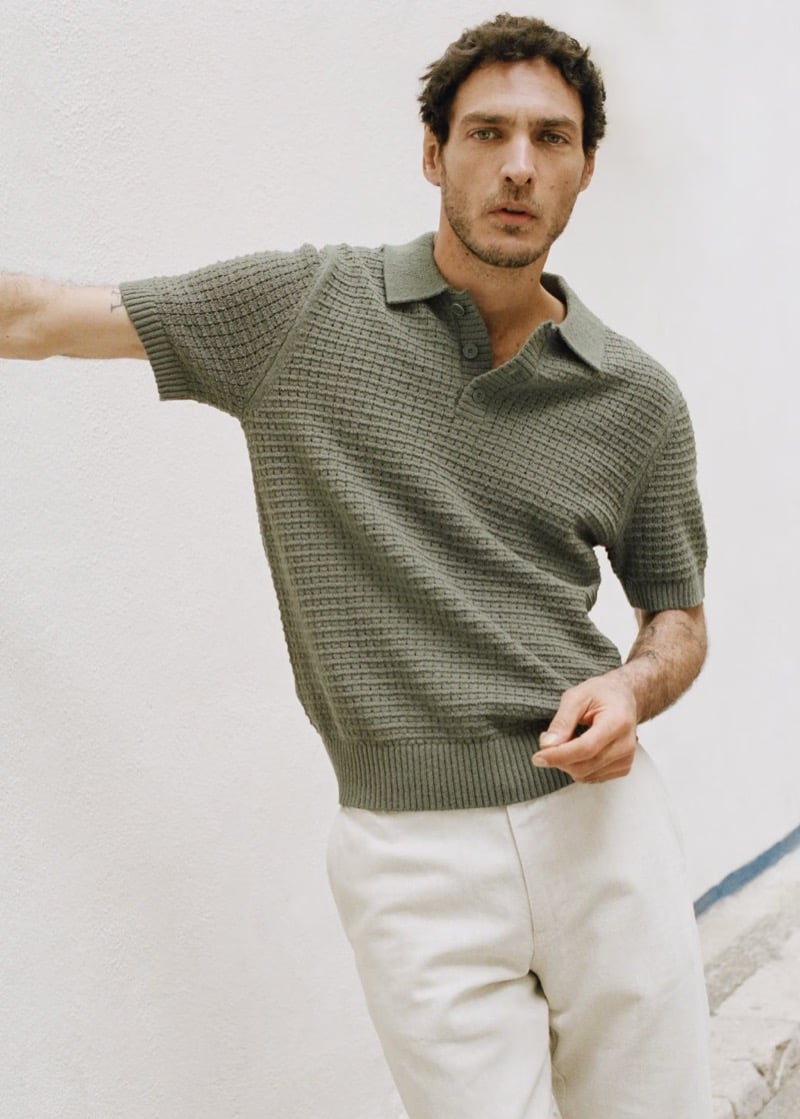 Pierre-Benoit wears a sage waffle-knit polo with white trousers